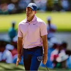  ?? Jamie Squire/Getty Images ?? Rory McIlroy reacts after missing a putt on the sixth green in the third round of the Masters. McIlroy shot a 71 and was unable to climb into contention.