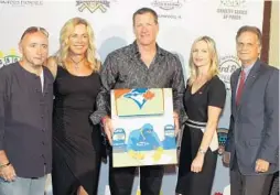  ?? PHOTOS BY KARA STARZYK/COURTESY ?? From left, Joseph Gormley, Cindy Conine, Jeff Conine, Caitlin Stella and Kevin Janser attend the Jeff Conine Celebrity Poker Classic at the Hard Rock Hotel and Casino.