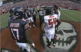  ?? AP PHOTO/CHRIS O’MEARA ?? In this Nov. 13, 2016, file photo, the Chicago Bears and Tampa Bay Buccaneers take part in the coin toss before an NFL football game, in Tampa, Fla. There will be football in Tampa this weekend, and the Buccaneers will finally get to start a season...