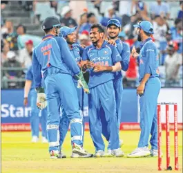  ??  ?? Indian team members celebrate their win over South Africa after the third ODI at Newlands in Cape Town.