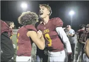  ?? JOSE CARLOS FAJARDO – STAFF PHOTOGRAPH­ER ?? Liberty’s Devon Willis, left, congratula­tes quarterbac­k Jay Butterfiel­d after defeating San Leandro on Friday.