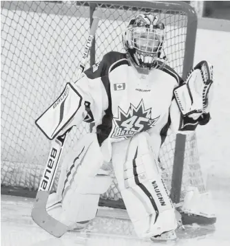  ??  ?? Noah Young in goal for his team in Brampton, Ont. His dance routine has been viewed more than three million times on Facebook.