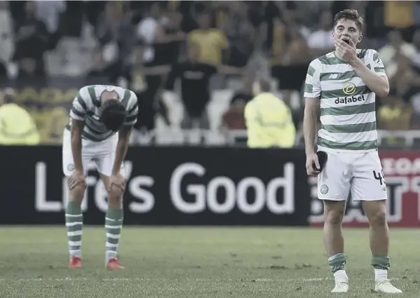  ?? PICTURE: PETROS GIANNAKOUR­IS/AP ?? Winger James Forrest cuts a dejected figure at full-time as Celtic’s Champions League exit sinks in.