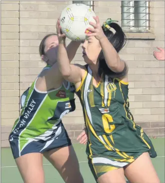  ??  ?? HARD WORK: Horsham District interleagu­e netballer Courtney Morrow in action against Loddon Valley Football Netball League. Picture: LYNTON BROWN