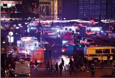  ?? OMER MESSINGER/ SIPA USA ?? A truck plowed into a crowded Christmas market on a city square in central Berlin on Monday, killing at least 12 people and injuring 48 others.