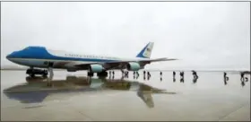  ?? JOSE LUIS MAGANA — THE ASSOCIATED PRESS FILE ?? Members of the White House press corps board Air Force One before the arrival of President Donald Trump at Andrews Air Force Base, Md.