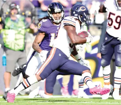  ?? | GETTY IMAGES ?? Safety Adrian Amos runs back his first career intercepti­on for a touchdown in the fourth quarter against the Ravens.