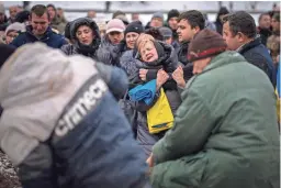  ?? EMILIO MORENATTI/AP ?? Nadia mourns at the grave of her son Oleg Kunynets, a Ukrainian military serviceman who was killed in the east of the country, during his funeral Tuesday in Lviv, Ukraine.