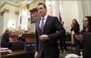  ?? RICH PEDRONCELL­I—ASSOCIATED PRESS ?? In this Tuesday, Feb. 12, 2019 photo, California Gov. Gavin Newsom receives applause after delivering his first state of the state address to a joint session of the legislatur­e at the Capitol in Sacramento, Calif. Newsom said the state’s consumers should get a “data dividend” from technology companies, like Google and Facebook, who are make by capitalizi­ng on the personal data they collect.