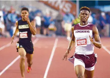  ?? Jerry Baker / For the Chronicle ?? George Ranch junior Champion Allison, right, pulls ahead of Fort Bend Marshall senior John Isom at the finish line during the Class 5A boys 400-meter dash at the UIL Track & Field Championsh­ips earlier this month.