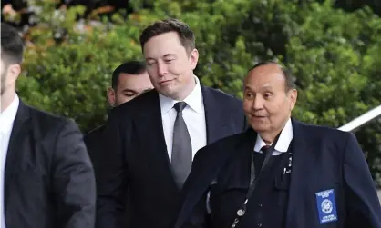  ??  ?? Elon Musk, second from right, arrives at US district court on Wednesday in Los Angeles. Photograph: Mark J Terrill/AP