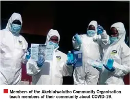  ??  ?? Members of the Akehlulwal­utho Community Organisati­on teach members of their community about COVID-19.