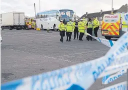  ?? Picture: David Wardle. ?? Emergency services workers at the scene of the accident in Dunfermlin­e.