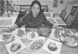  ?? (Larry Fabian) ?? CHEF Maricris Agas shows the exact menu of dishes she prepared for the President during his visit in the summer capital gracing the PMA graduates last weekend.