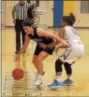  ?? GENE WALSH — DIGITAL FIRST MEDIA ?? Phoenixvil­le’s Marlee Brown works to break the press of Upper Merion defender Aaliyah Parson.