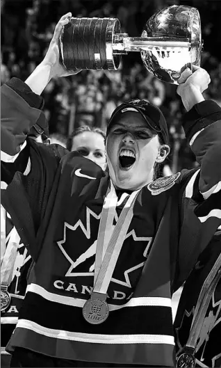  ?? DAVE SANDFORD / HOCKEY CANADA ?? Team Canada captain Cassie Campbell says players like 21-year-old Gillian Apps, shown above after winning the Women’s World Ice Hockey Championsh­ips in 2004, are pushing women’s hockey to the next level. Apps will skate for Team Canada at the 2006...