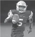  ?? NICOLAS GALINDO/THE COLUMBUS DISPATCH ?? Linden junior quarterbac­k Chris Towns already holds nearly all of the school’s passing records.