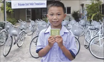  ??  ?? One of the boys at the Christina Noble Sunshine School with his bicycle, with funds raised in the Drogheda area.