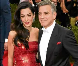  ?? —CONTRIBUTE­D PHOTO ?? George (right) with wife, Amal