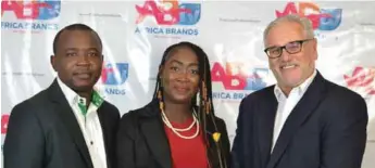  ??  ?? L-R; Jide Odelola, a senior brand and innovation manager at Mouka Limited, presenter of the African Brand Congress Award, Adekunle Megbuwawon and Femi Fapohunda, a director at Mouka Limited at the award presentati­on in Lagos on Friday