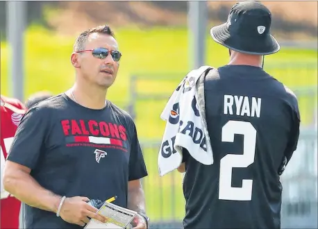  ?? CURTIS COMPTON / CCOMPTON@AJC.COM ?? The Falcons brought in former USC and University of Washington head coach Steve Sarkisian (with quarterbac­k Matt Ryan at training camp last week) as offensive coordinato­r after Kyle Shanahan was hired as the San Francisco 49ers’ head coach.