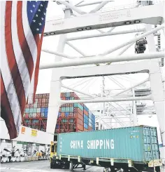  ??  ?? Shipping containers are being loaded onto Xin Da Yang Zhou ship from Shanghai, China at Pier J at the Port of Long Beach in Long Beach, California. The United States and China should avoid a trade war, China’s Ambassador to the United States Cui...