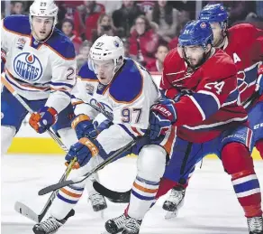  ?? MINAS PANAGIOTAK­IS/GETTY IMAGES ?? When the time comes to extend Connor McDavid’s contract with the Oilers, a figure of $97 million over eight seasons might be in order. It would match his number, and lock up one of the game’s best players, Jim Matheson writes.