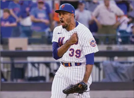  ?? Mary Altaffer / Associated Press ?? New York Mets closer Edwin Diaz reacts after recording a strikeout against the Braves in New York.