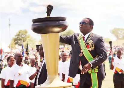  ?? — Picture: Believe Nyakudjara ?? President Mnangagwa lights the Independen­ce Flame at Uhera Stadium, Murambinda B High School in Buhera during the 44th Independen­ce Day Celebratio­ns yesterday.