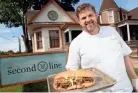  ?? JOE RONDONE ?? Chef Kelly English holds out a roast beef Po’ Boy in front of his restaurant, The Second Line in Overton Square.