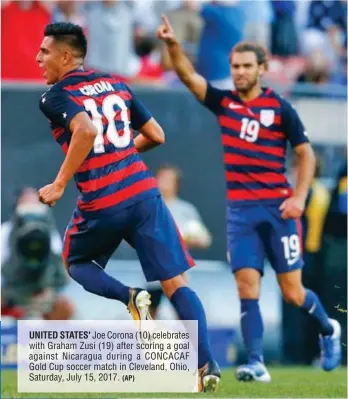  ?? (AP) ?? UNITED STATES' Joe Corona (10) celebrates with Graham Zusi (19) after scoring a goal against Nicaragua during a CONCACAF Gold Cup soccer match in Cleveland, Ohio, Saturday, July 15, 2017.