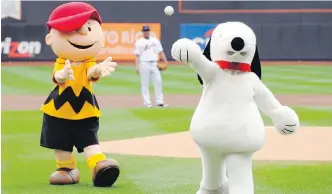  ??  ?? Peanuts characters throws out a ceremonial first pitch at a New York Mets game.