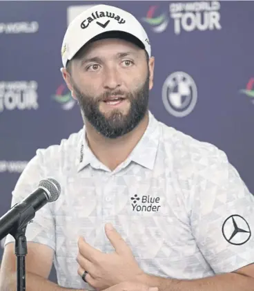  ?? ?? ↑ Jon Rahm speaks at a press conference prior to the DP World Tour Championsh­ip in Dubai