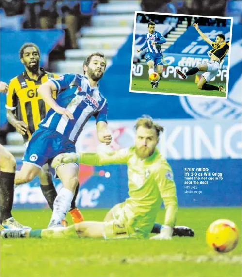  ?? PICTURES: Media Image ?? FLYIN’ GRIGG: It’s 3-0 as Will Grigg finds the net again to seal the deal