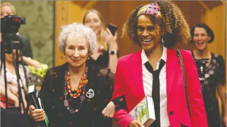 ?? SIMON DAWSON/REUTERS ?? A decision to award the Booker Prize to both Margaret Atwood, left, and Bernardine Evaristo has not been well-received.