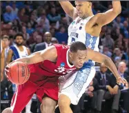  ?? NWA Democrat-Gazette/J.T. WAMPLER ?? Arkansas Razorbacks center Moses Kingsley (left) had nine points in the team’s 72-65 loss to North Carolina on Sunday in the South Regional of the NCAA Tournament. The Razorbacks went scoreless over the game’s final 3:31 after leading 65-60.