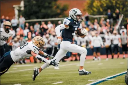  ?? NATE HECKENBERG­ER — FOR DIGITAL FIRST MEDIA ?? Malvern Prep’s Ryan Maguire pulls away from La Salle’s Frank Joyce for a big gain in the first quarter of their game earlier this season.