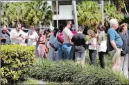  ?? LYNNE SLADKY/AP PHOTO ?? People wait in line to vote at the Supervisor of Elections office Tuesday in Delray Beach, Fla. This polling station was made available after some precincts in Palm Beach County were unable to open after poll workers did not report to work.