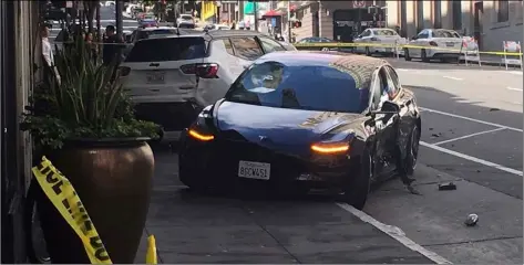  ??  ?? This photo taken July 21 provided by KGO-TV shows the scene after a woman was arrested after running a red light in a rented Tesla in San Francisco and causing a crash that killed a tourist and left his wife critically injured. KATE LARSEN/KGO-TV VIA AP