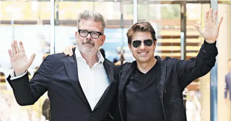  ?? CHUNG SUNG-JUN/GETTY ?? Christophe­r McQuarrie, left, and Tom Cruise in Seoul, South Korea, in support of “Mission: Impossible — Fallout” in 2018.