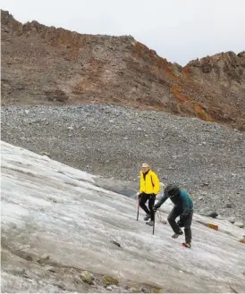  ??  ?? Left: Naturalist Peter Devine (left) of Yosemite Conservanc­y and Chronicle outdoors writer Tom Stienstra climb the disappeari­ng Lyell Glacier at 12,500 feet in the Yosemite Wilderness.