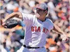  ?? JEFF CHIU/ASSOCIATED PRESS ?? San Francisco’s Matt Moore held the Reds to one run in 7⅓ innings on Saturday afternoon to lead the Giants to a 3-1 victory.