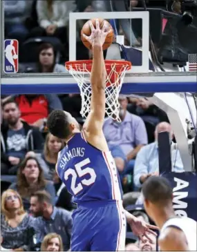  ?? RICK BOWMER — THE ASSOCIATED PRESS ?? The 76ers’ Ben Simmons (25) dunks against the Utah Jazz during the first half Tuesday in Salt Lake City.