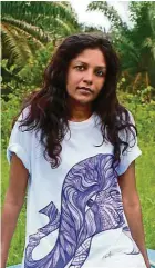  ??  ?? Christine wearing a T-shirt with her artwork to raise funds for elephants.
