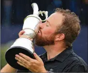  ?? ANDREW REDINGTON / GETTY IMAGES ?? “I can’t believe this is me standing here,” Shane Lowry said as he cradled golf’s oldest trophy after winning the British Open on Sunday in Portrush, Northern Ireland. “I can’t believe this is mine.”