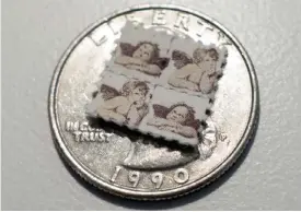  ??  ?? WASHINGTON: This photo shows LSD blotter tabs on top of a US quarter coin in Washington, DC. — AFP