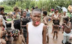  ??  ?? CONGOLESE migrants expelled from Angola who crossed the border wash their clothes in a river near Kamako, Kasai province, near the border with Angola in the DRC at the weekend. | Reuters