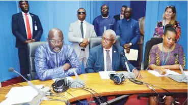  ??  ?? Liberian President, Mr Weah (left) and representa­tive of ECOWAS Commission President, Amado talking on the ECOWAS radio.