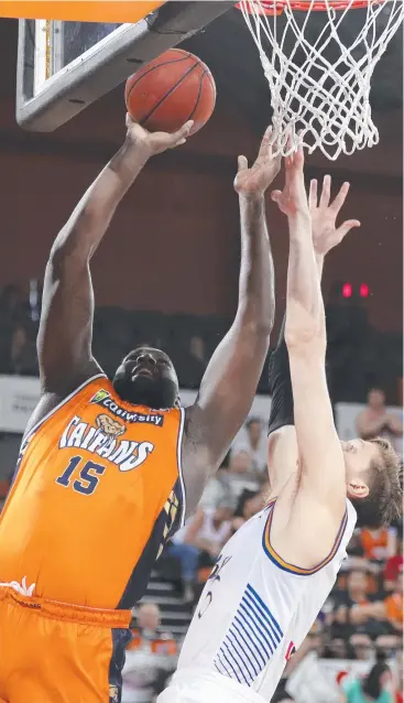  ??  ?? BIG GAME: Nate Jawai of the Cairns Taipans drives to the basket during the Round 12 NBL match against the Brisbane Bullets at the Cairns Convention Centre. Picture: AAP