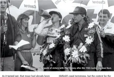  ??  ?? Enjoying the spoils of victory with Paul Feeney after the 1985 Castrol Six Hour Race.